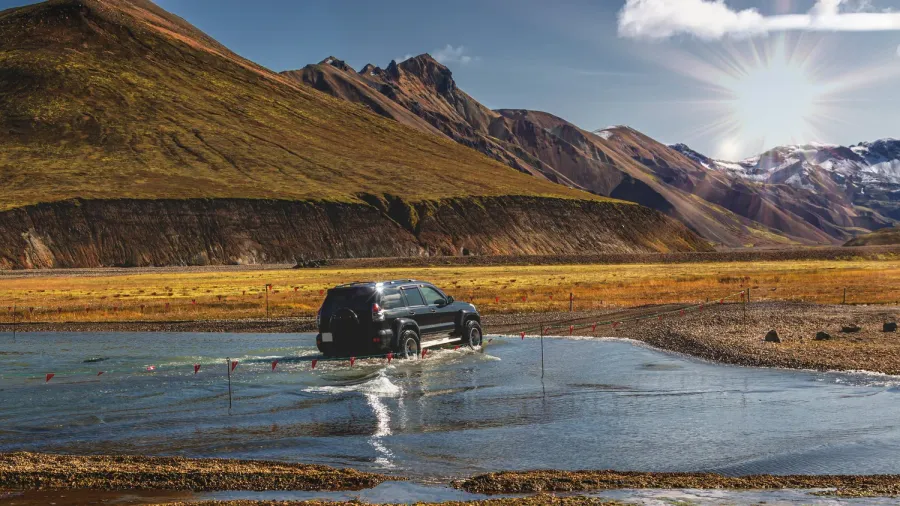 4x4 vehicle crossing a river in the Icelandic highlands