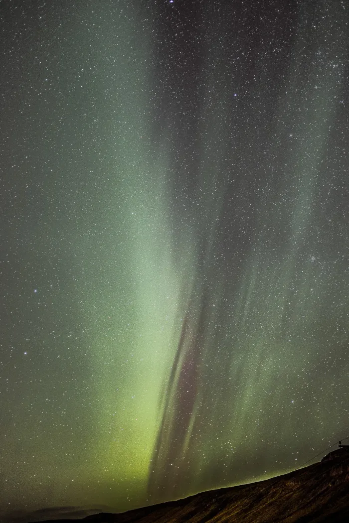 Northern Lights dancing over an Icelandic glacier lagoon