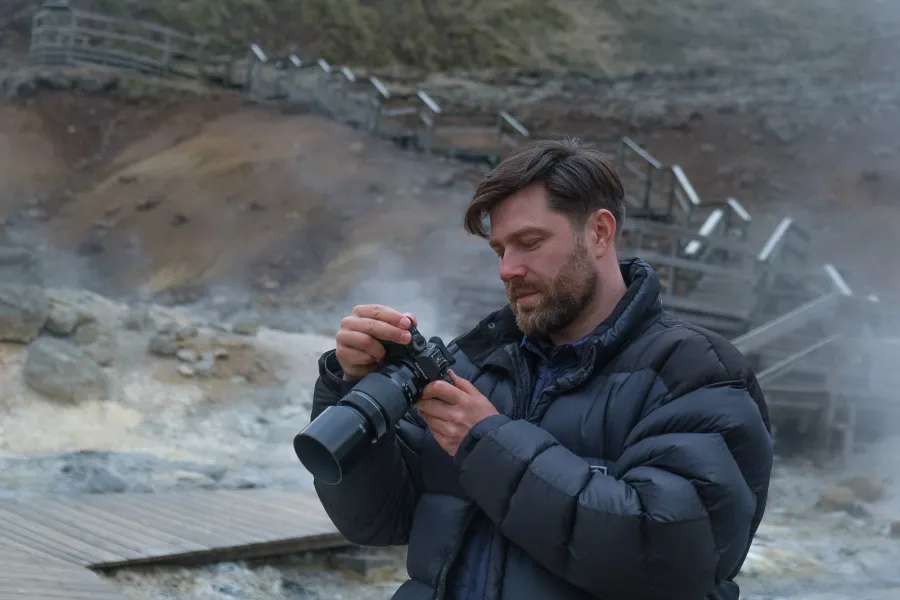 Luke photographing the geothermal landscape at Reykjanes